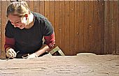 Karolina Kubisz working on the medival gravestone, East Church Cromarty